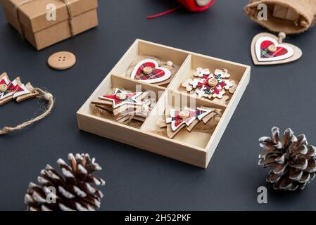 Wooden Christmas decorations on the table ready for decorating the Christmas tree. Close up Stock Photo