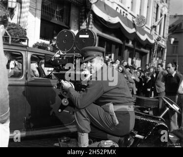 CLARK GABLE on set location candid in Holland next to movie Camera during filming of BETRAYED 1954 director GOTTFRIED REINHARDT cinematographer Freddie Young Metro Goldwyn Mayer Stock Photo