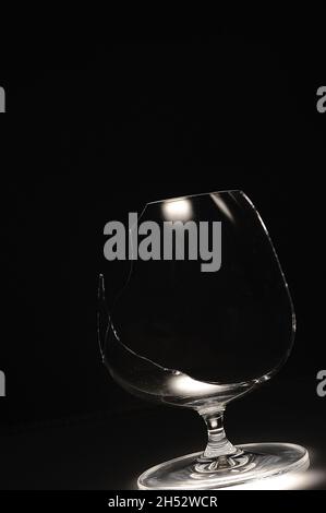 Broken wine glass on a black background Stock Photo