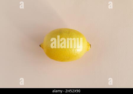 lemon on pink background, flat lay view Stock Photo