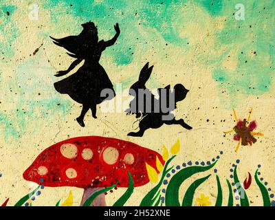 Painted pedestrian subway in Latchford, Cheshire, depicting Alice in Wonderland Stock Photo