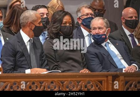 Former United States President Barack Obama, former first lady Michelle Obama, and former US President George W. Bush converse as they await the start of the funeral of former US Secretary of State Colin L. Powell at the Washington National Cathedral in Washington, DC on Friday, November 5, 2021.Credit: Ron Sachs/CNP /MediaPunch Stock Photo