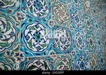 front view close up of Islamic ottoman era blue ceramic ornament tiles with flowers in Topkapi Palace museum Istanbul Stock Photo