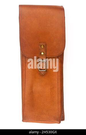 front view closeup of closed handmade vintage brown leather satchel pouch with rough weathered texture and metallic buckle isolated on white backgroun Stock Photo