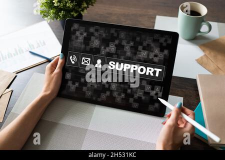Technical support icons on screen. Call to help center. Internet and technology concept. Stock Photo