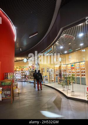 POZNAN, POLAND - Nov 26, 2017: The people walking next to a store in the shopping mall in Poznan, Poland Stock Photo