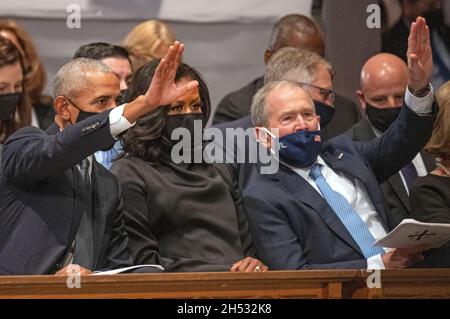 Former United States President Barack Obama, former first lady Michelle Obama, and former US President George W. Bush wave as they await the start of the funeral of former US Secretary of State Colin L. Powell at the Washington National Cathedral in Washington, DC on Friday, November 5, 2021.Credit: Ron Sachs / CNP/Sipa USA Stock Photo