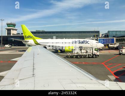 Riga, Latvia - May 5, 2018: AirBaltic Aircraft preparation for departure in the Riga International Airport. Stock Photo