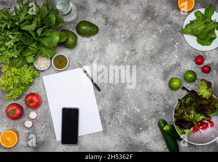 Open Notebook and Fresh Vegetables Background diet Stock Photo