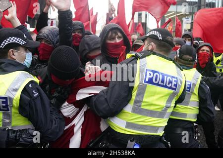 Police halt part of a march by protesters taking part in a rally organised by the Cop26 Coalition in Glasgow demanding global climate justice. Picture date: Saturday November 6, 2021. Stock Photo