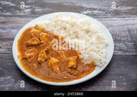 Red Thai chicken curry with sticky white rice Stock Photo