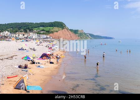 Sidmouth Devon Families on the beach at Sidmouth beach esplanade  Promenade Sidmouth Town Sidmouth Devon England UK GB Stock Photo