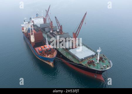 Overloading Cargo The dry-cargo ships costs in the sea. Vessels overload cargo Stock ...