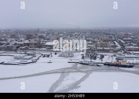 Arkhangelsk, Russia - January 7, 2021:The city on river bank, in the winter, is photographed from above. Stock Photo