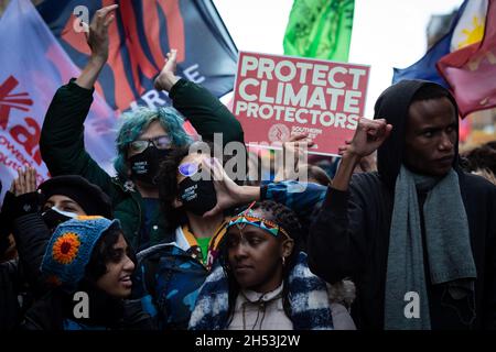 Glasgow, UK. 06th Nov, 2021. Protesters with a placards march through the city during the Global Day of Action.ÊThe protest sees movements mobilising against the world leaders attending the COP26 Climate summit. Credit: Andy Barton/Alamy Live News Stock Photo