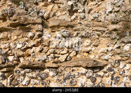 Closeup detail of the ruined Roman town wall showing the flint and stone core held together by lime mortar at Silchester. Hampshire, UK Stock Photo