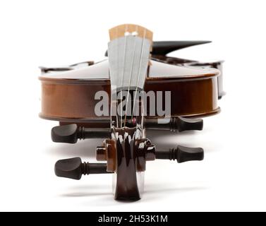 Violin curl and pegs close-up. Violin on a white background. Copy space Stock Photo