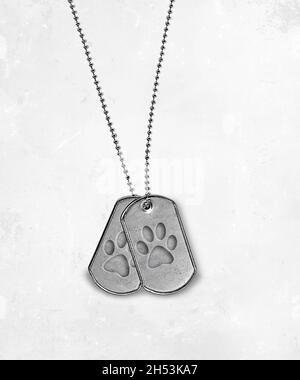 Military dog tags with dog paw print design isolated on soft white textured background Stock Photo