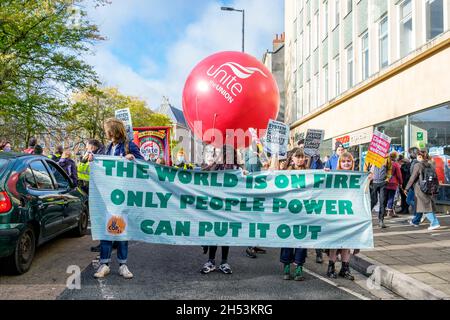 Bristol, UK, 6th November, 2021. Protesters carrying climate change banners and placards are pictured as they take part in a climate change protest march through the centre of Bristol. The protest was one of hundreds held around the world today as people took to the streets to push world leaders to act as their negotiators meet in Glasgow at the COP 2021 United Nations Climate Change Conference. Credit: Lynchpics/Alamy Live News Stock Photo