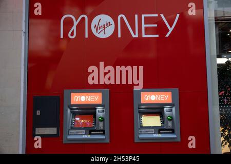 Virgin Money store cashpoint machines on 15th October 2021 in Birmingham, United Kingdom. Virgin Money is a banking and financial services brand operating in the United Kingdom. The Virgin Money brand was founded by Richard Branson in March 1995. It was originally known as Virgin Direct, and pioneered index tracking by launching a value personal equity plan into the market. Stock Photo