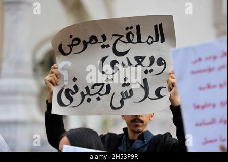 November 6, 2021: Tunis, Tunisia. 06 November 2021. A few dozen people hold a protest against compulsory vaccinations and Covid passes in front of the Municipal Theatre in the Tunisian capital. Demonstrators raised slogans against Covid-19 vaccines and the obligation of the vaccine pass, questioning their safety and expressing fears of possible side-effects. Tunisian authorities have recently announced that a proof of full vaccination is required to attend both public and private gatherings, with a Covid-19 vaccine pass also becoming mandatory to enter public as well as private spaces such as Stock Photo