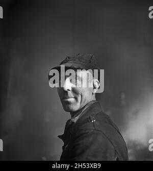 Worker in Roundhouse at Chicago and North Western Railroad yard, Chicago, Illinois, USA, Jack Delano, U.S. Farm Security Administration, U.S. Office of War Information Photograph Collection, December 1942 Stock Photo