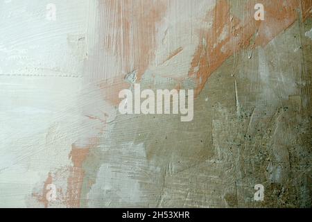 Old weathered painted plastered interior wall with new white stucco layer texture background Stock Photo