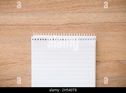 Open notebook notepad flat lay on desk with copy space. Ideal for a background template for journal, journaling, notes or school Stock Photo