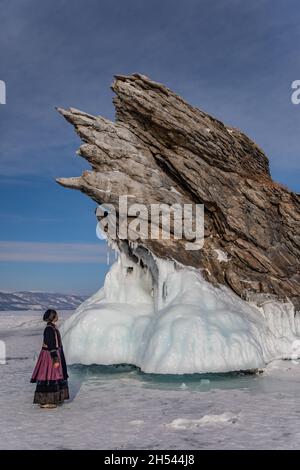 A Buryat girl standing near Ogoi island on Baikal Lake Stock Photo
