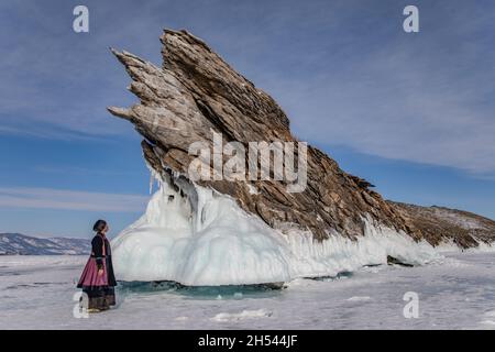 A Buryat girl standing near Ogoi island on Baikal Lake Stock Photo
