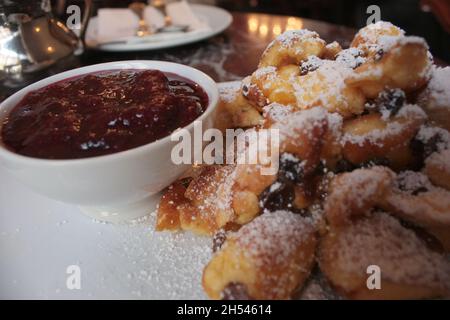 cut-up and sugared pancake with raisins and plum marmelade in a Vienna cafe Stock Photo