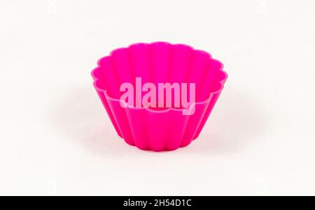 Pink silicone cake cups isolated on white background Stock Photo