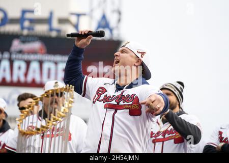 Former Atlanta Braves outfielder Joc Pederson, who received his World Series  ring from the Braves in a pre-game ceremony, tips his helmet to cheering  Braves fans as he enters the game during