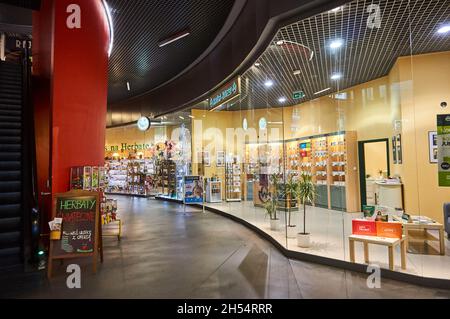 POZNAN, POLAND - Nov 26, 2017: The corridor with shops in the Kupiec Poznanski shopping mall Stock Photo