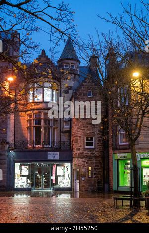 Street scene with sculpture on the Plainstones. High Street, Royal Burgh of Elgin, Moray, Scotland, UK, Britain Stock Photo