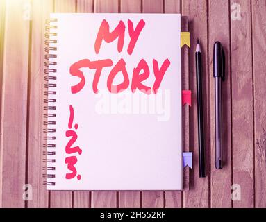 Inspiration showing sign My Story. Business approach your past life events actions or choices you made Blank Open Spiral Notebook With Diffrent Pens Stock Photo