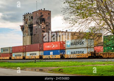 Freight train passes grain elevators in Thunder Bay Ontario. Stock Photo