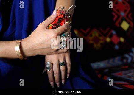 Needlewoman's hands Stock Photo