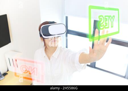 girl using the virtual reality glasses Stock Photo