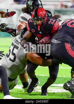 San Diego State running back Rashaad Penny, right, carries the ball ...