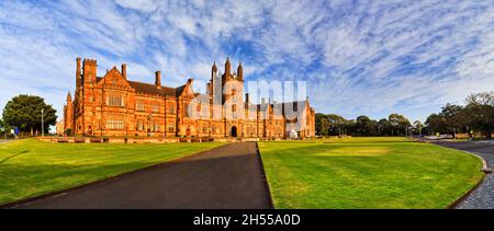 Left angle view of main building in Sydney education precinct with historic architecture and green lawns. Stock Photo