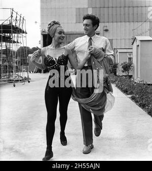 LUDMILLA TCHERINA and her husband Dancer EDMOND AUDRAN outside the Silent Stage at Shepperton Studios during filming of THE TALES OF HOFFMANN 1951 directed written and produced by MICHAEL POWELL and EMERIC PRESSBURGER music by Jacques Offenbach English libretto Dennis Arundell conductor Sir Thomas Beecham production design Hein Heckroth costume design Ivy Baker and Hein Heckroth choreographer Frederick Ashton The Archers / Vega Film Productions / British Lion Film Corporation Stock Photo