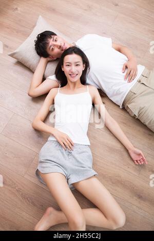 Young couple resting on the floor Stock Photo