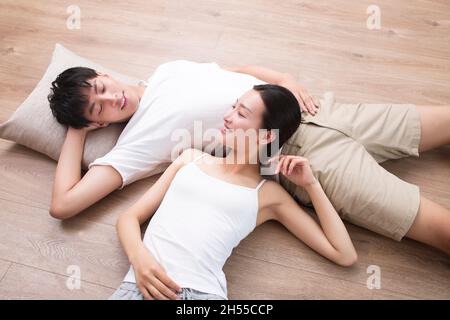 Young couple resting on the floor Stock Photo