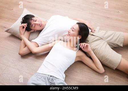 Young couple resting on the floor Stock Photo