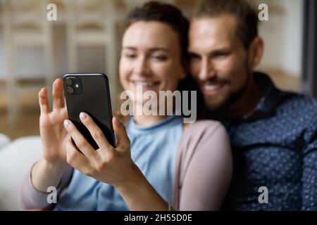 Close up happy young couple using cellphone. Stock Photo