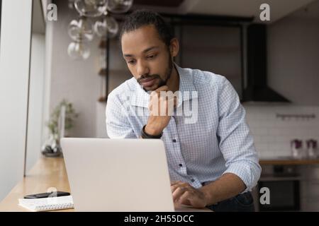 Pensive young african american businessman thinking of problem. Stock Photo
