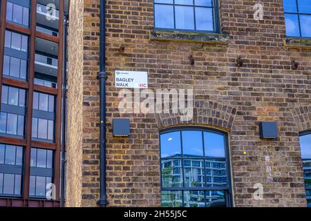 Sign on side of brick building of Bagely Walk, NC1 in Camden, London, UK Stock Photo
