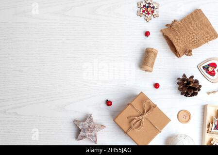 Rustic Christmas decorations on white wooden background. Top view, flat lay composition with copy space Stock Photo