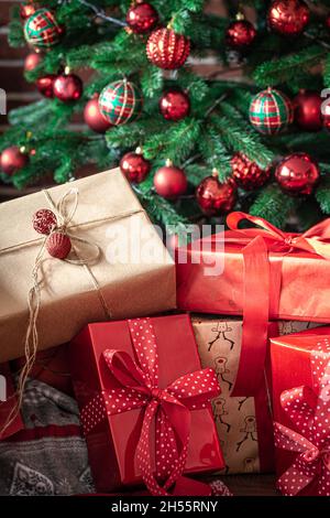 Close-up of red gift boxes near the Christmas tree. Stock Photo